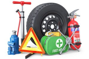Vehicle winter safety kit including a spare tire, tire pump, first aid kit, caution sign, fire extinguisher, and more
