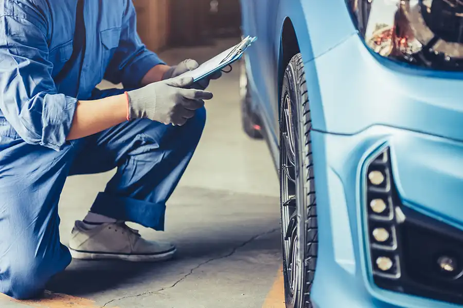 Jack Stoldt Auto Service—A mechanic examines a vehicle to perform professional maintenance services in Springfield, IL.